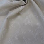 Whute floral sprays on soft sandy background 